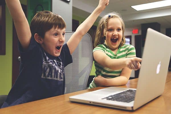 Excited kid at laptop